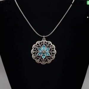 Touchstone Crystal Silver and Blue Necklace with Intricate Pendant